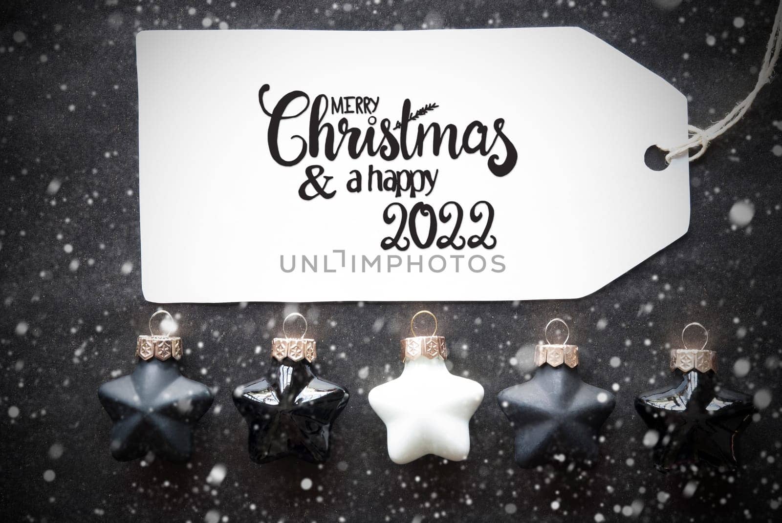 Label With English Calligraphy Merry Christmas And A Happy 2022. Black Christmas Ball Ornament With Snowflakes