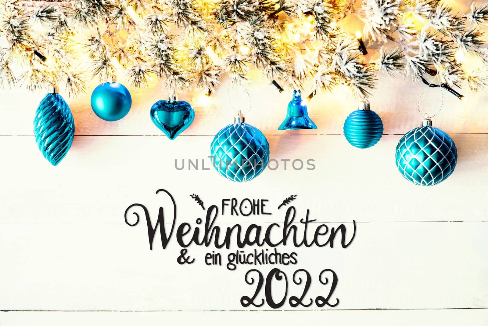 Christmas Decoration With German Calligraphy Frohe Weihnachten Und Ein Glueckliches 2022 Mean Merry Christmas And A Happy 2022. Fir Tree Branch With Shiny Fairy Lights