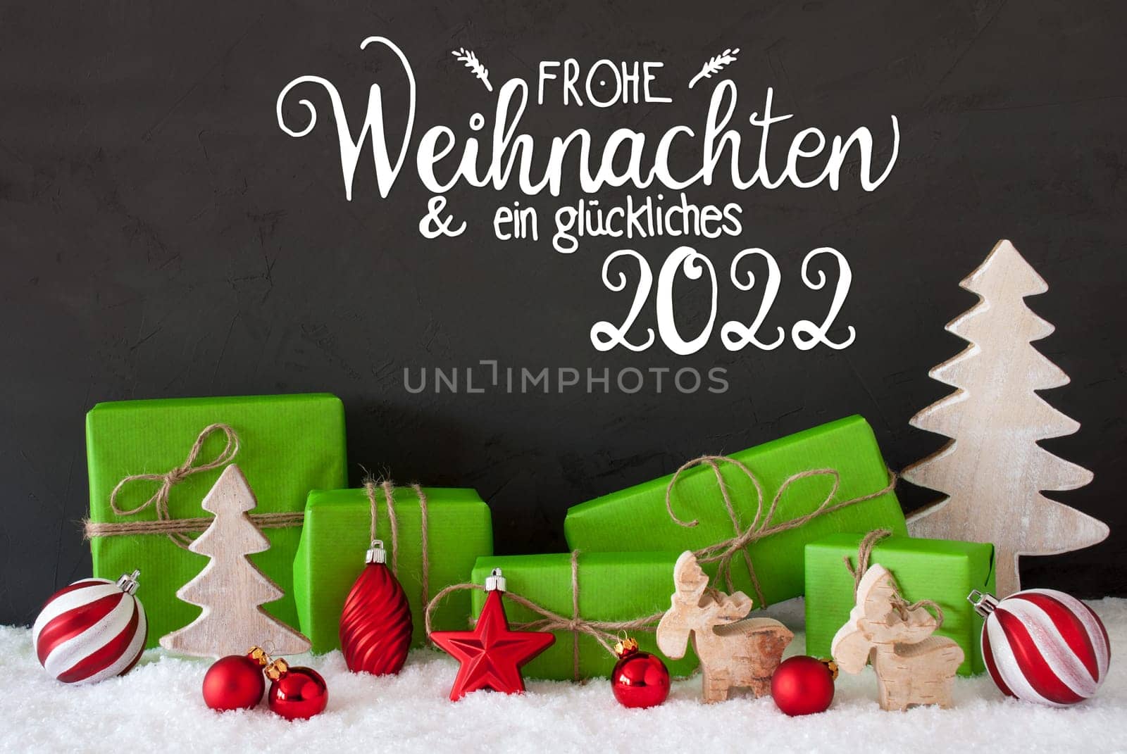 German Calligraphy Frohe Weihnachten Und Ein Glueckliches 2022 Means Merry Christmas And A Happy 2022. Green Christmas Present With Decoration Like Tree, Reindeer And Ball. Black Background With Snow