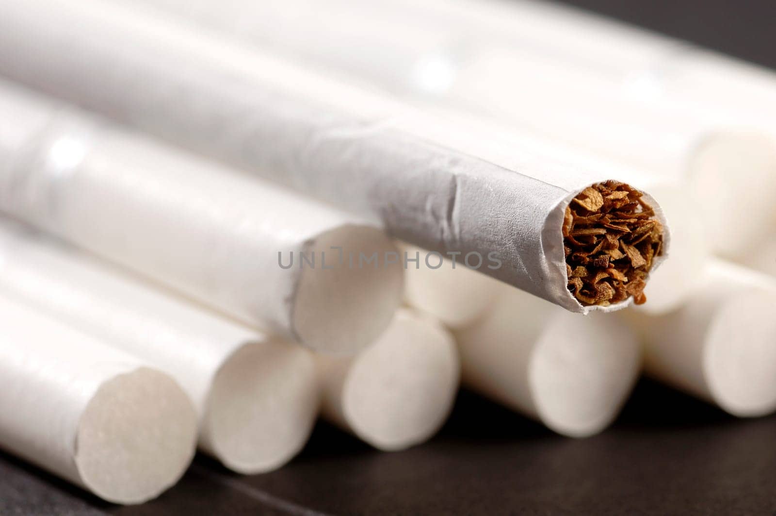 different types of cigarettes on a white background