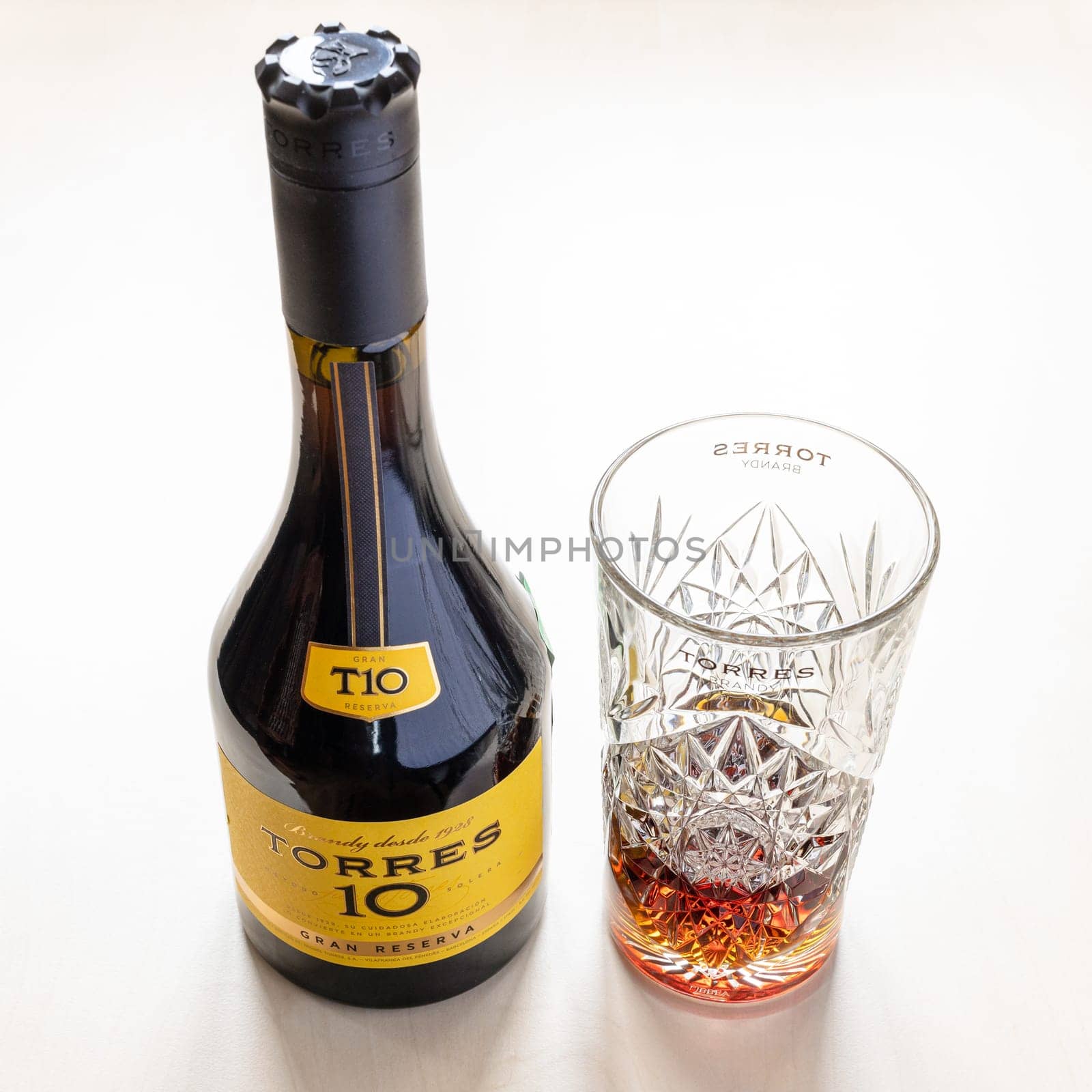 Moscow, Russia - October 16, 2021: TORRES Gran Reserva 10 spanish brandy and and crystal tumbler. Torres 10 Gran Reserva is the most popular Spanish brandy in world, it has been produced since 1946
