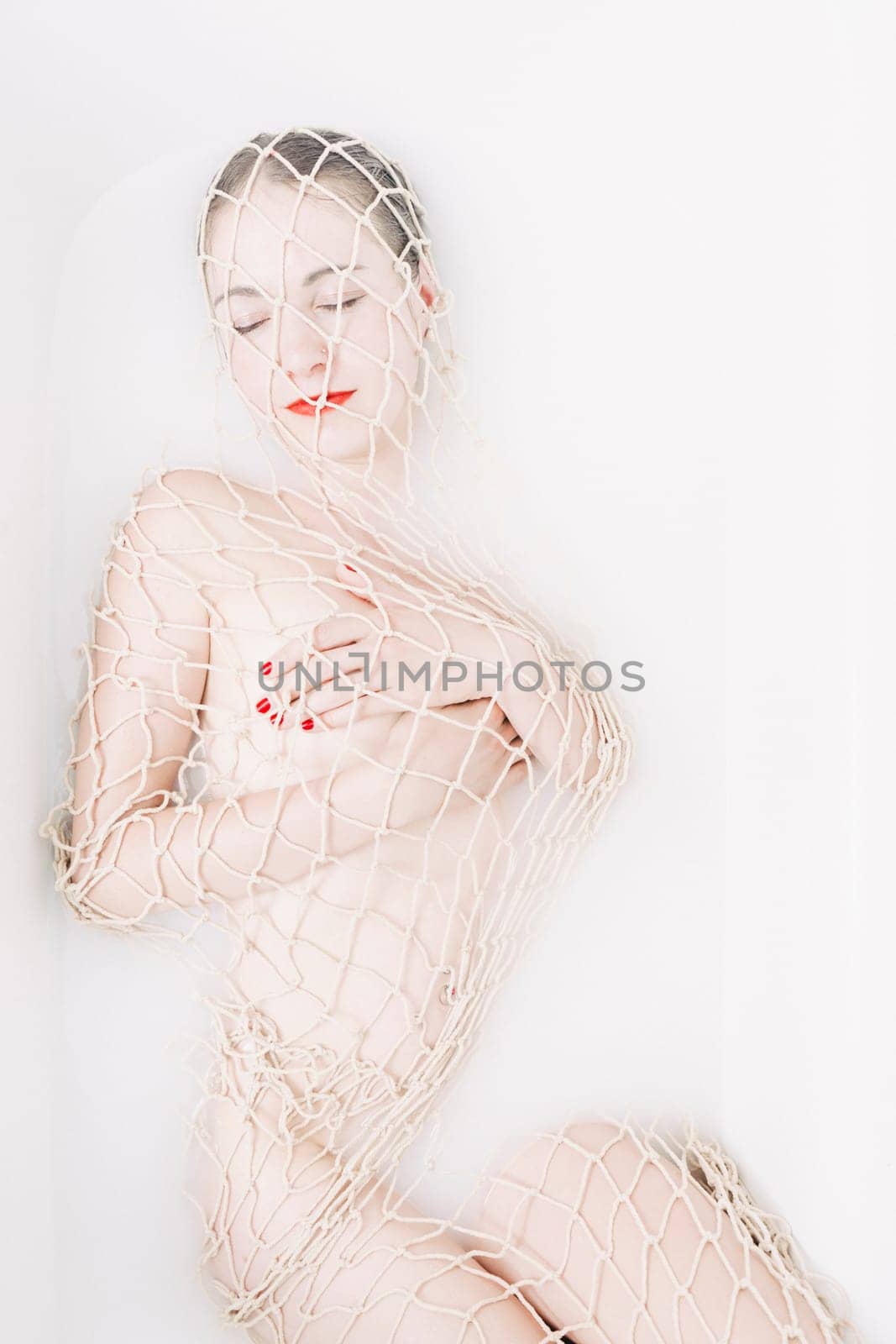 young woman in the bathtub at wellness