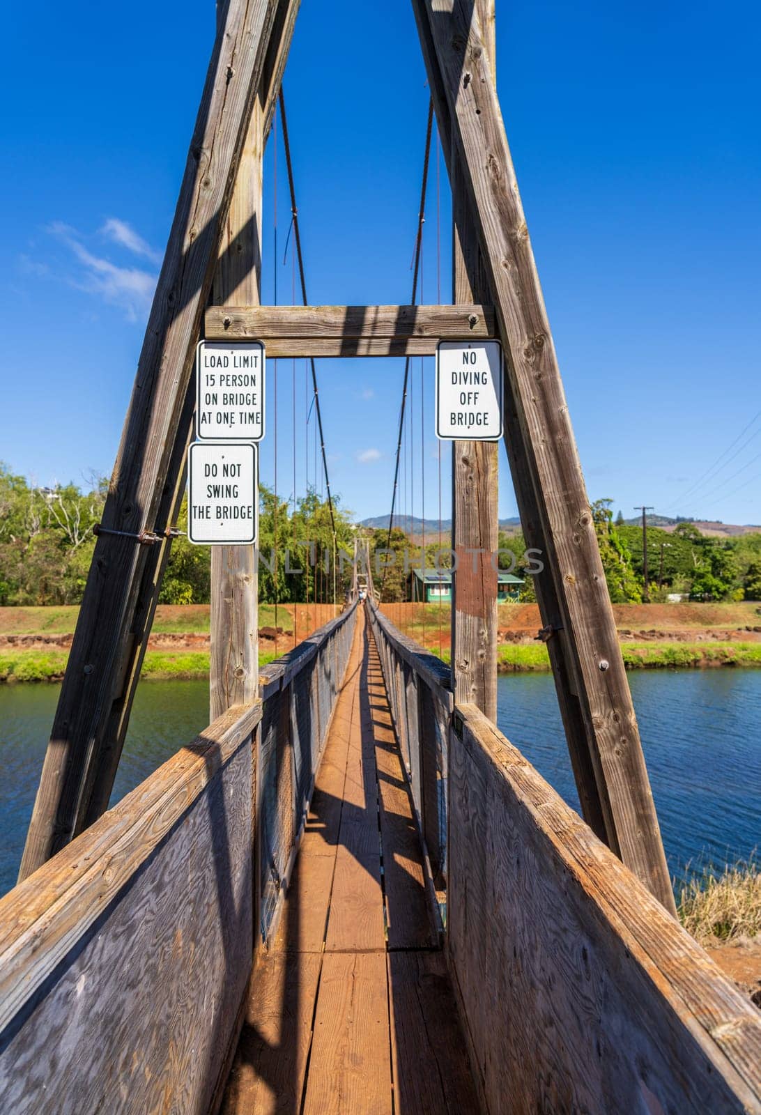 Structure of the historic wooden swinging bridge across the river in Hanapepe, Kauai