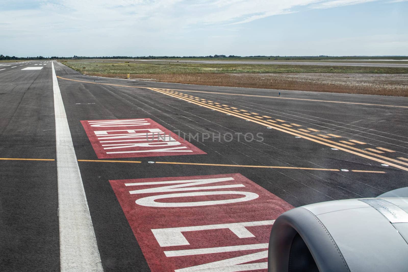 detail of touch down of aircraft with turbine and detail of runway