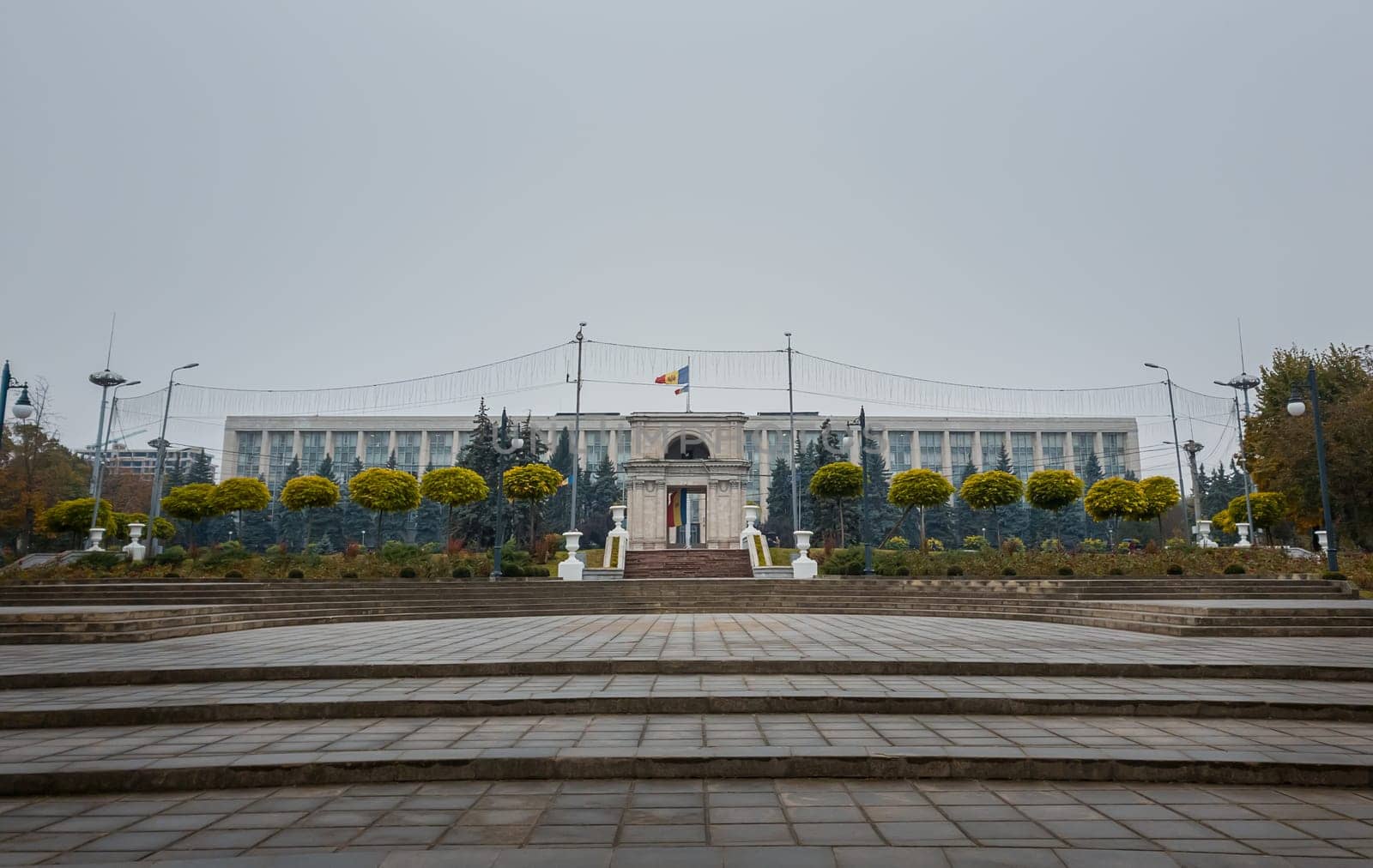 View from the square of the Triumphal Arch in front of the government building, Chisinau, Moldova. Historical landmarks of the capital city..