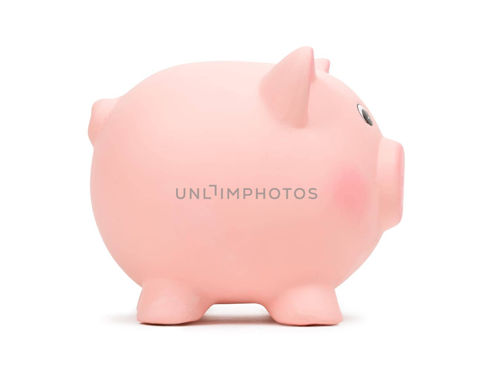Pink ceramic piggy bank, side view, isolated on white background