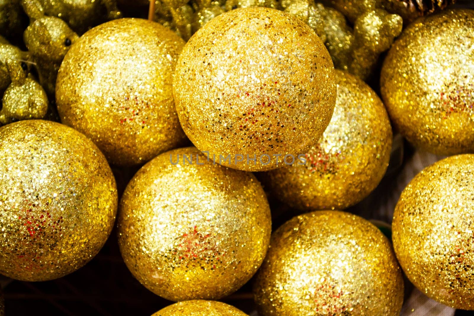 Christmas tree balls decoration golden background, close up