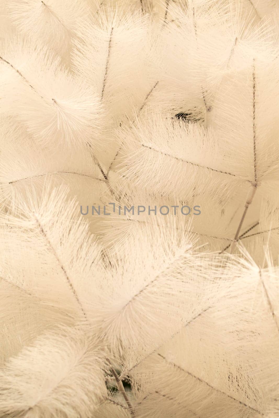 Faux Christmas tree. White fluffy christmas tree branches Artificial white branch pattern. Vertical image