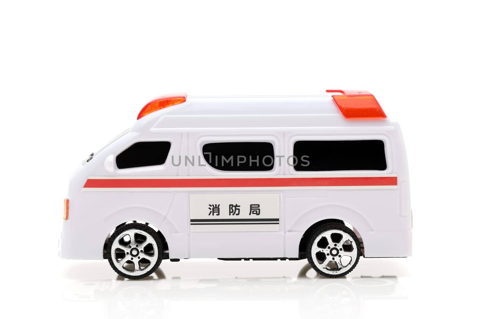 Japanese toy ambulance car isolated on white background, Translation: "Fire department"""