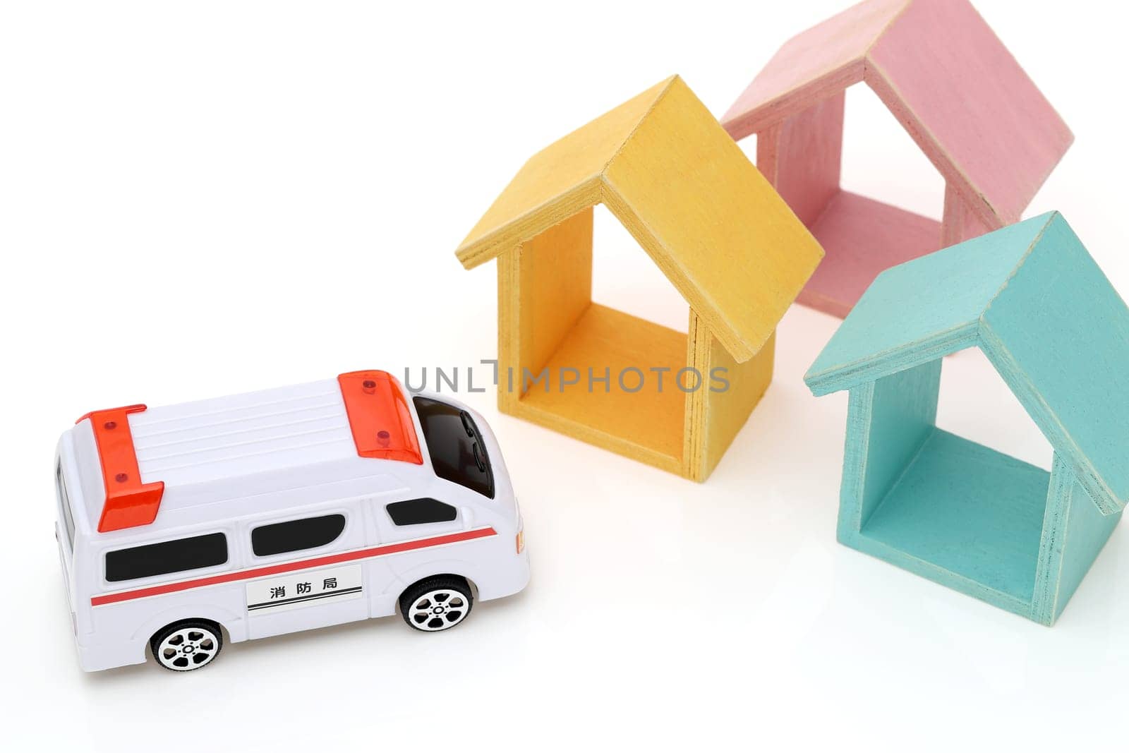 Japanese toy ambulance car isolated on white background, Translation: "Fire department"""