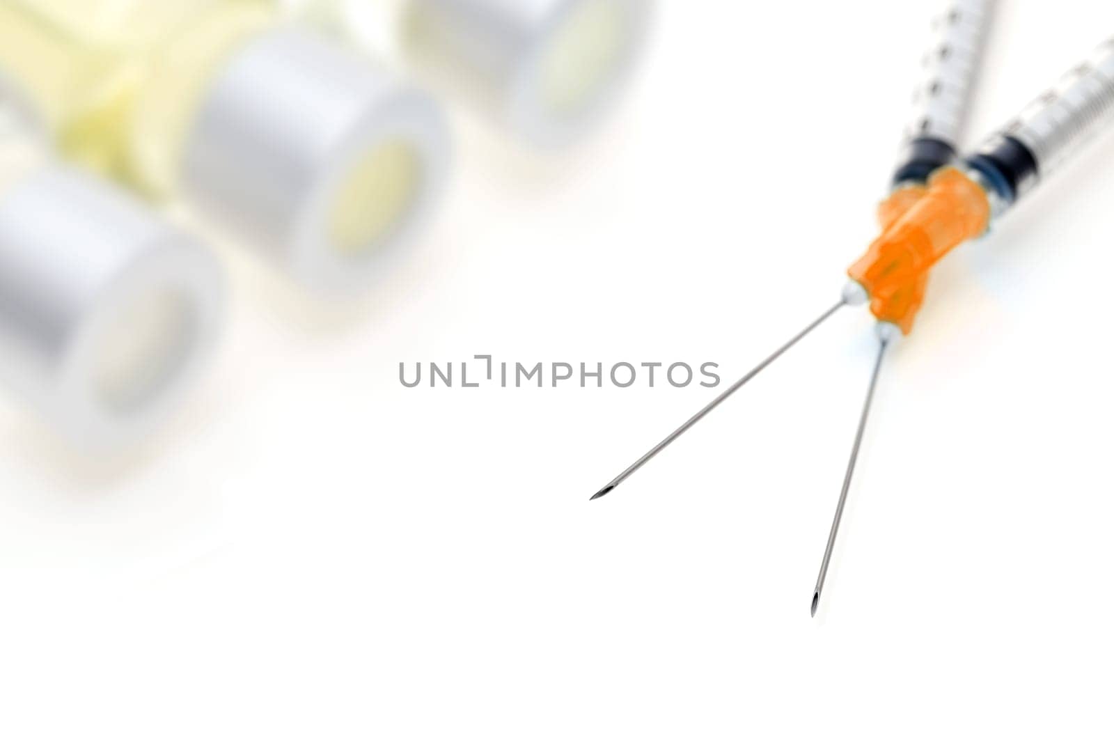 medical disposable syringe with vaccine bottle on white background