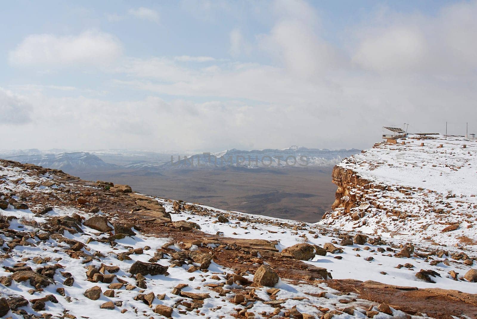 Mitzpe Ramon next to the crater Machtesh Ramon covered in snow, Negev desert in winter time, Israel