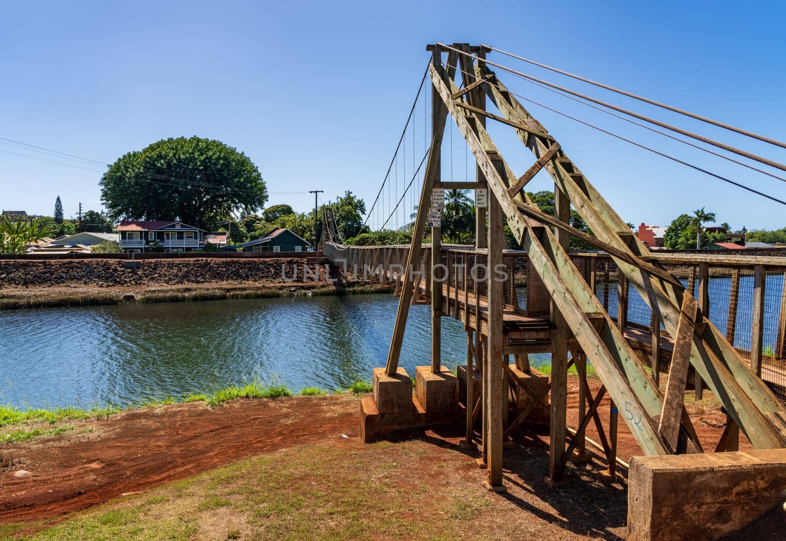 Structure of the historic wooden swinging bridge across the river in Hanapepe, Kauai