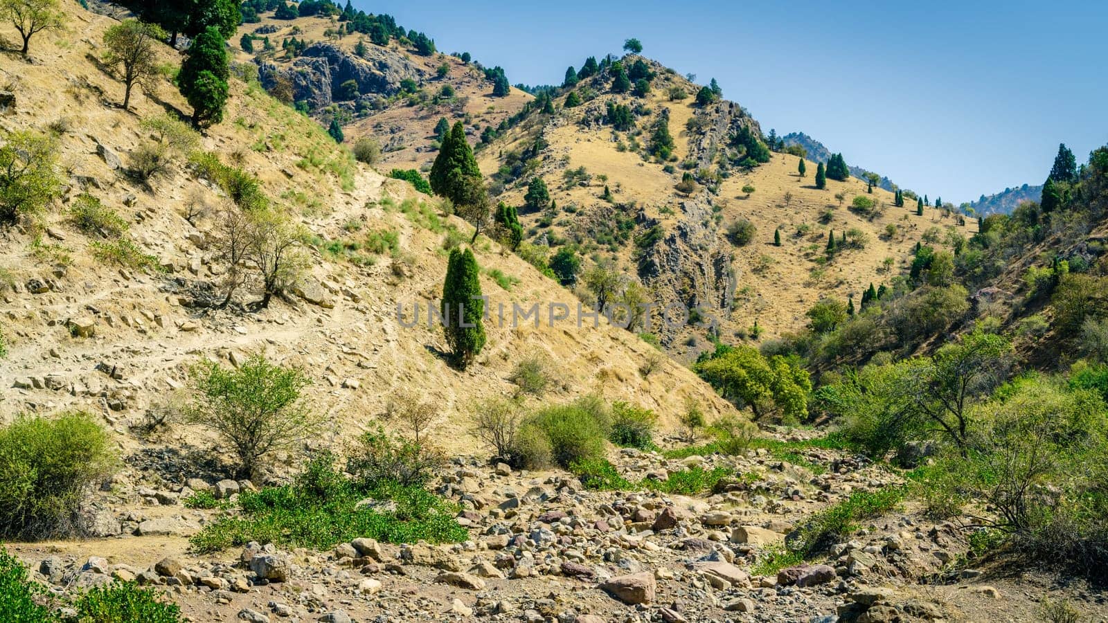 Dry river bed and a trail in Hissar Valley in Tajikistan