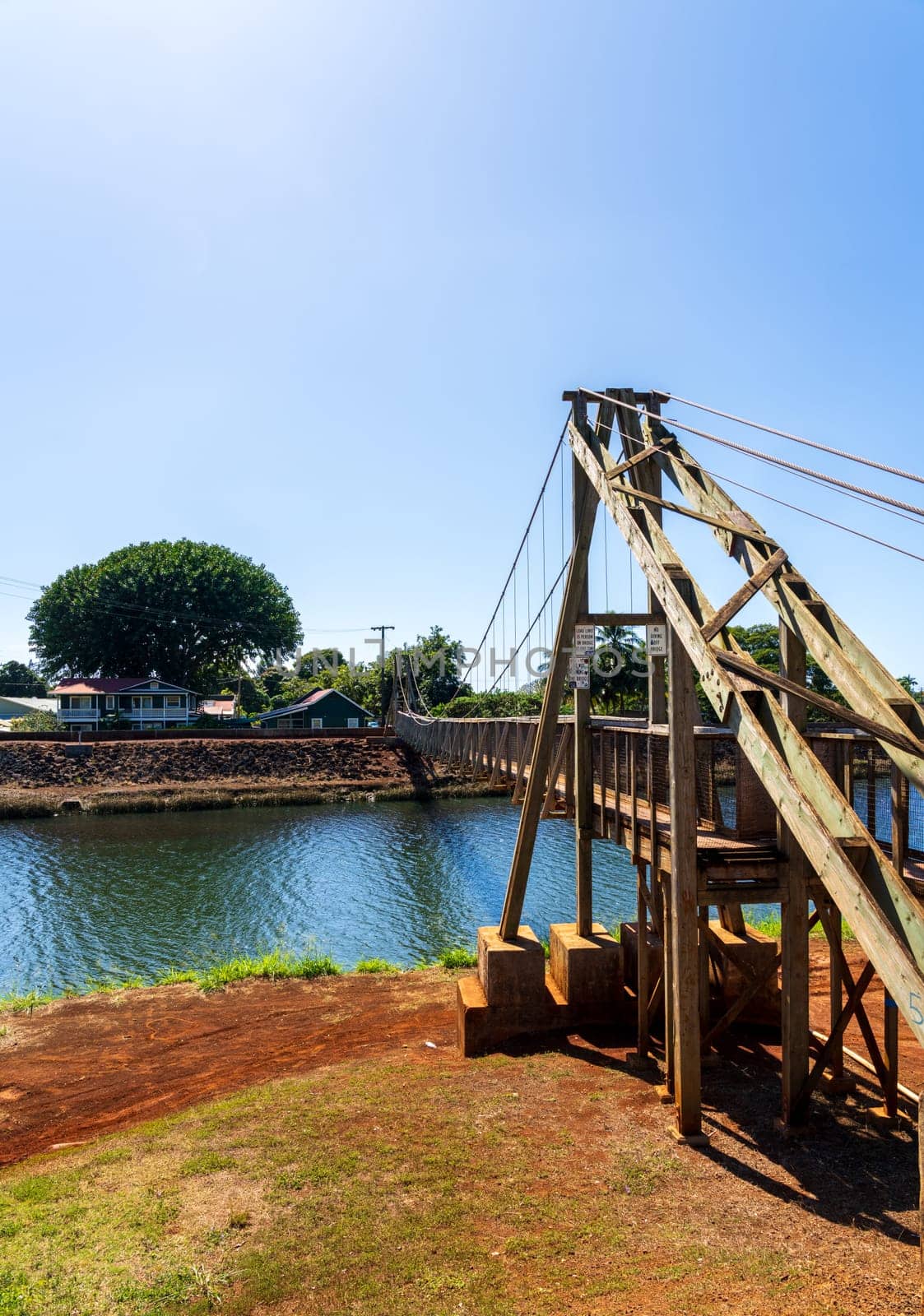 Structure of the historic wooden swinging bridge across the river in Hanapepe, Kauai