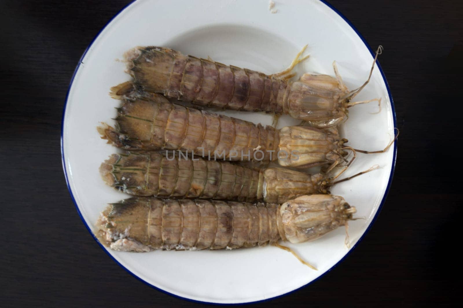 steamed crayfish or mantis shrimps or stomatopods   on white plate