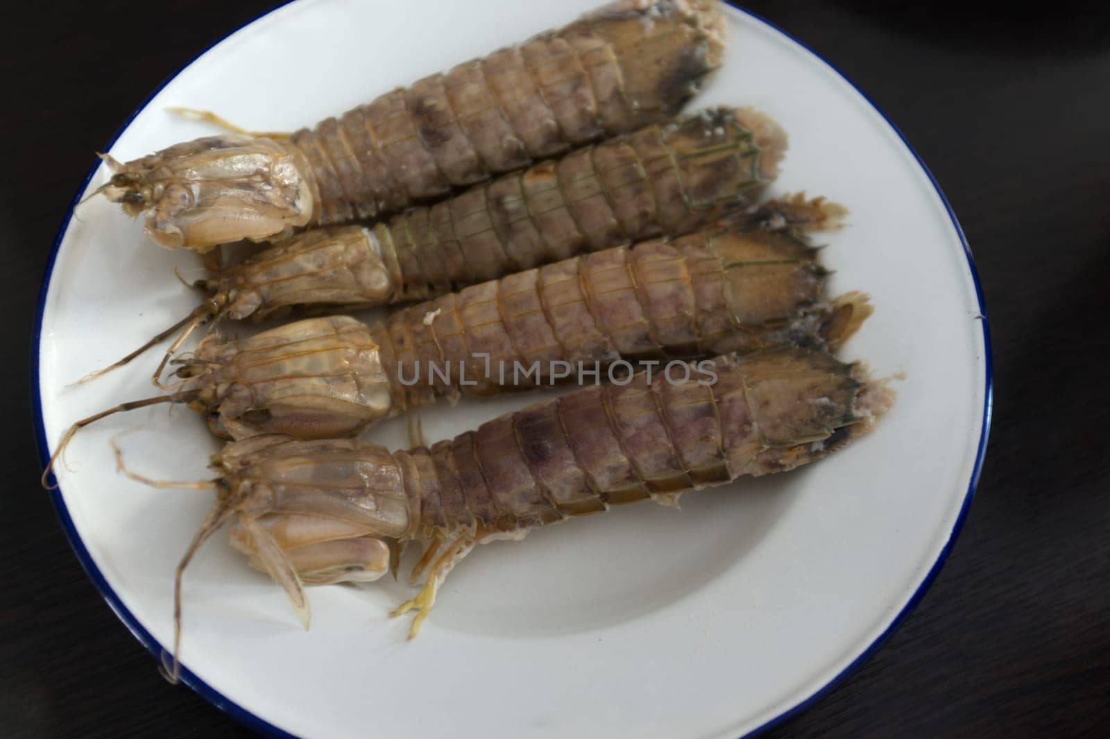 steamed crayfish or mantis shrimps or stomatopods   on white plate