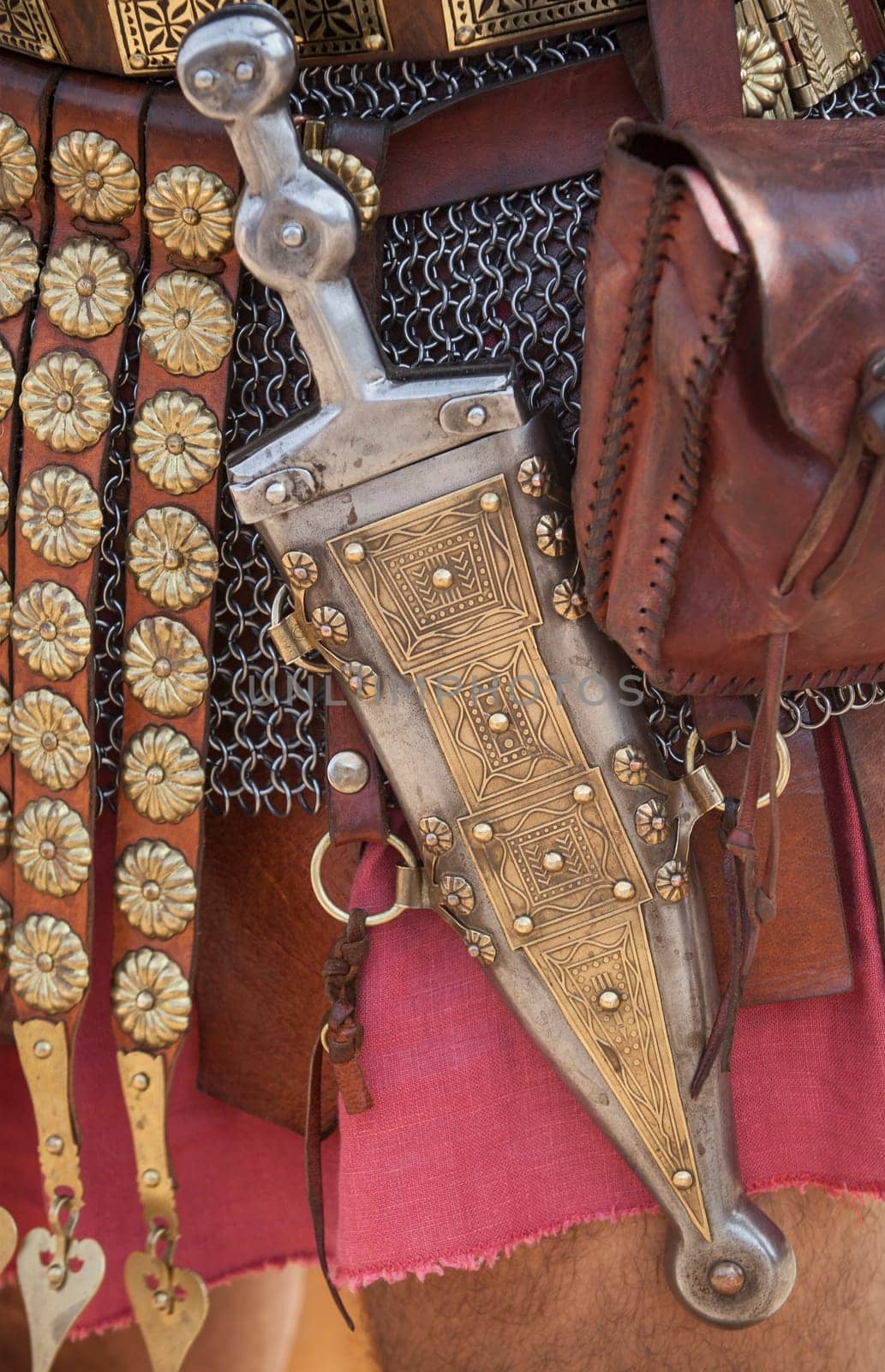 Centurion girding a pugio, a dagger used by roman soldiers as a sidearm. Historical reenactment