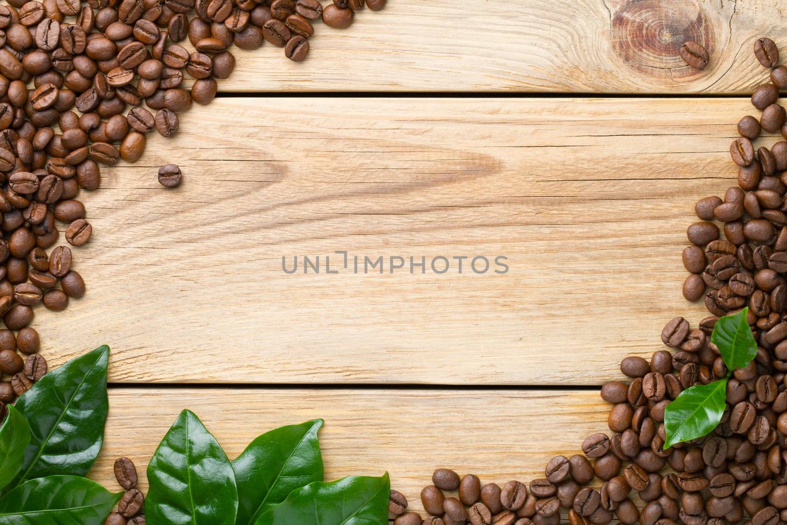 Coffee beans on wood background. Top view