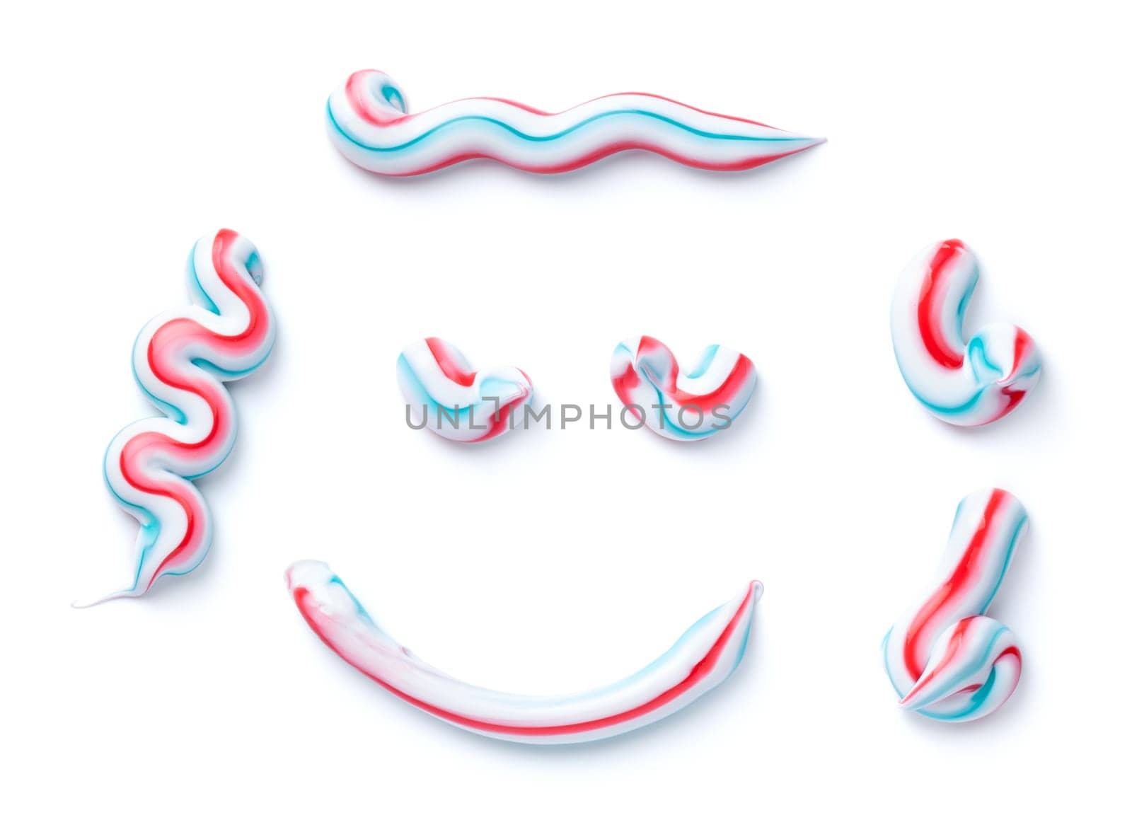 Set of striped toothpaste isolated on white background. Top view