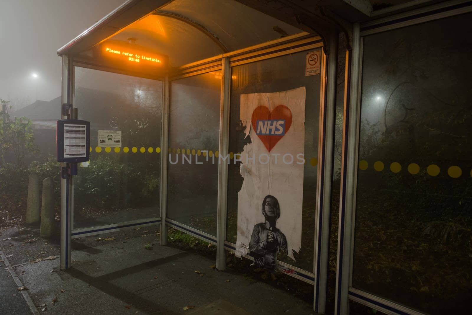 Sheffield, United Kingdom, 8th November, 2020: NHS Thank you appreciation poster partially torn down in a bus shelter, in the style of Banksy artwork