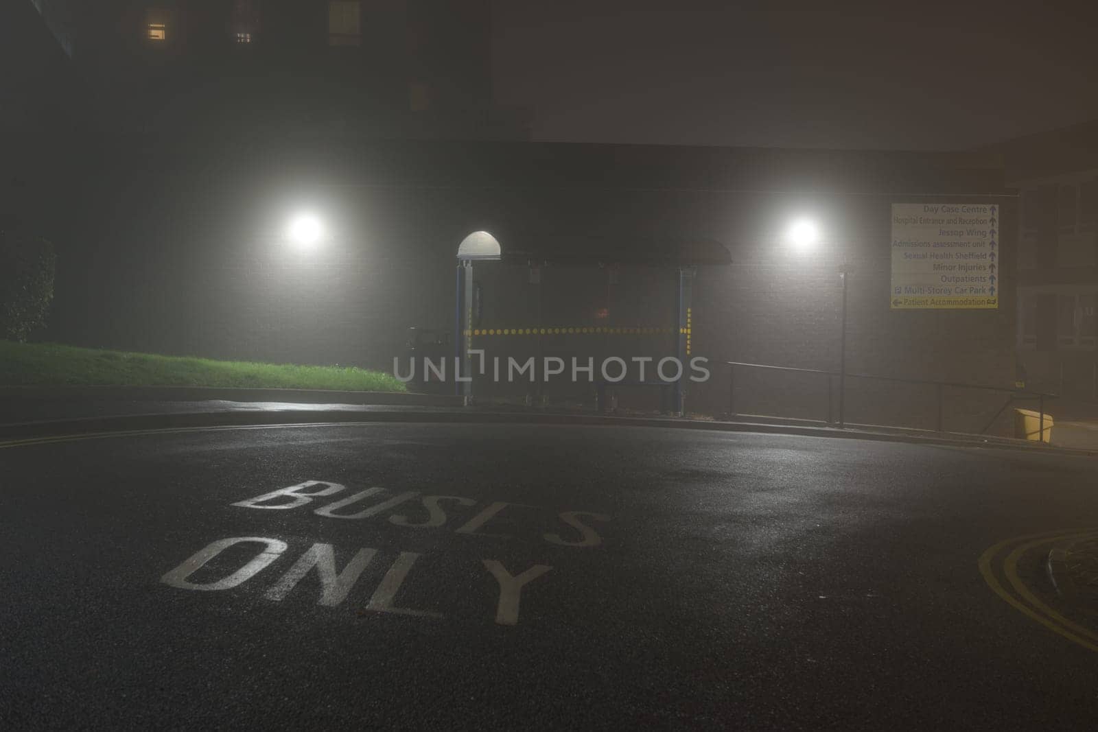 Sheffield, United Kingdom, 8th November, 2020: NHS Hallamshire hospital bus stop, beech hill road or glossop road. Night time lights with heavy fog