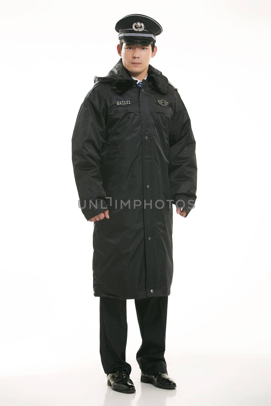 Create all kinds of work clothes policeman stands in front of a white background