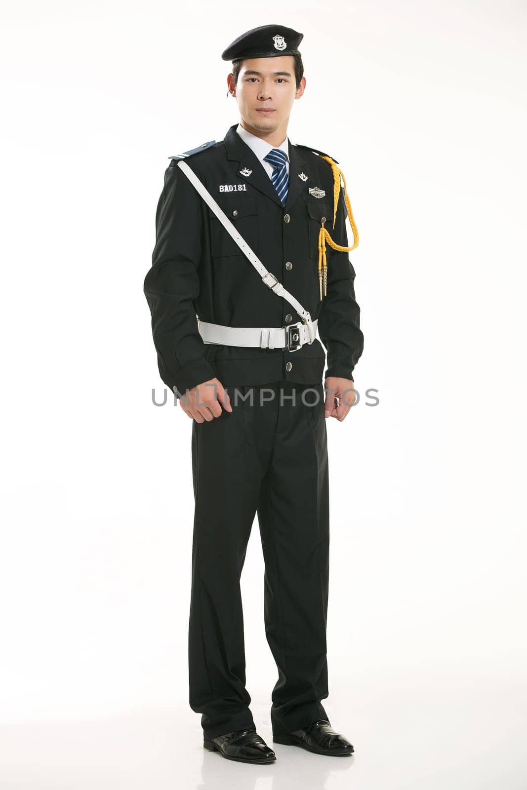 Create all kinds of work clothes policeman stands in front of a white background