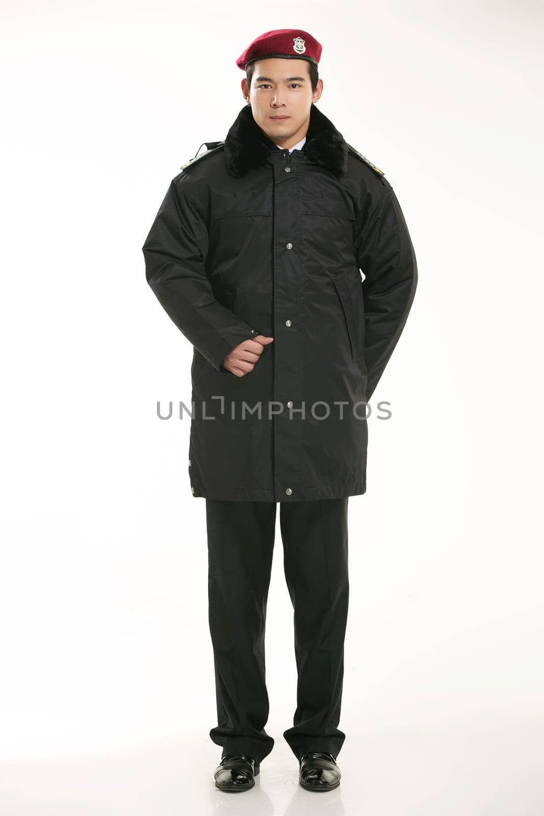 Create all kinds of work clothes policeman stands in front of a white background