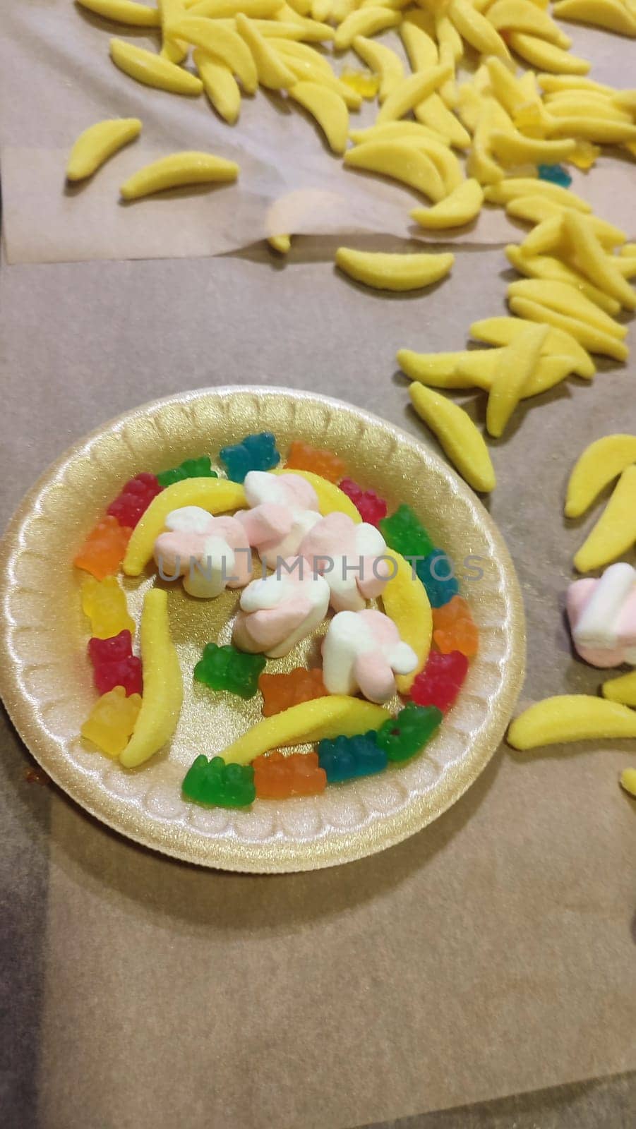 children sweet candy dessert food plate colorful delicious. High quality photo vertical format image