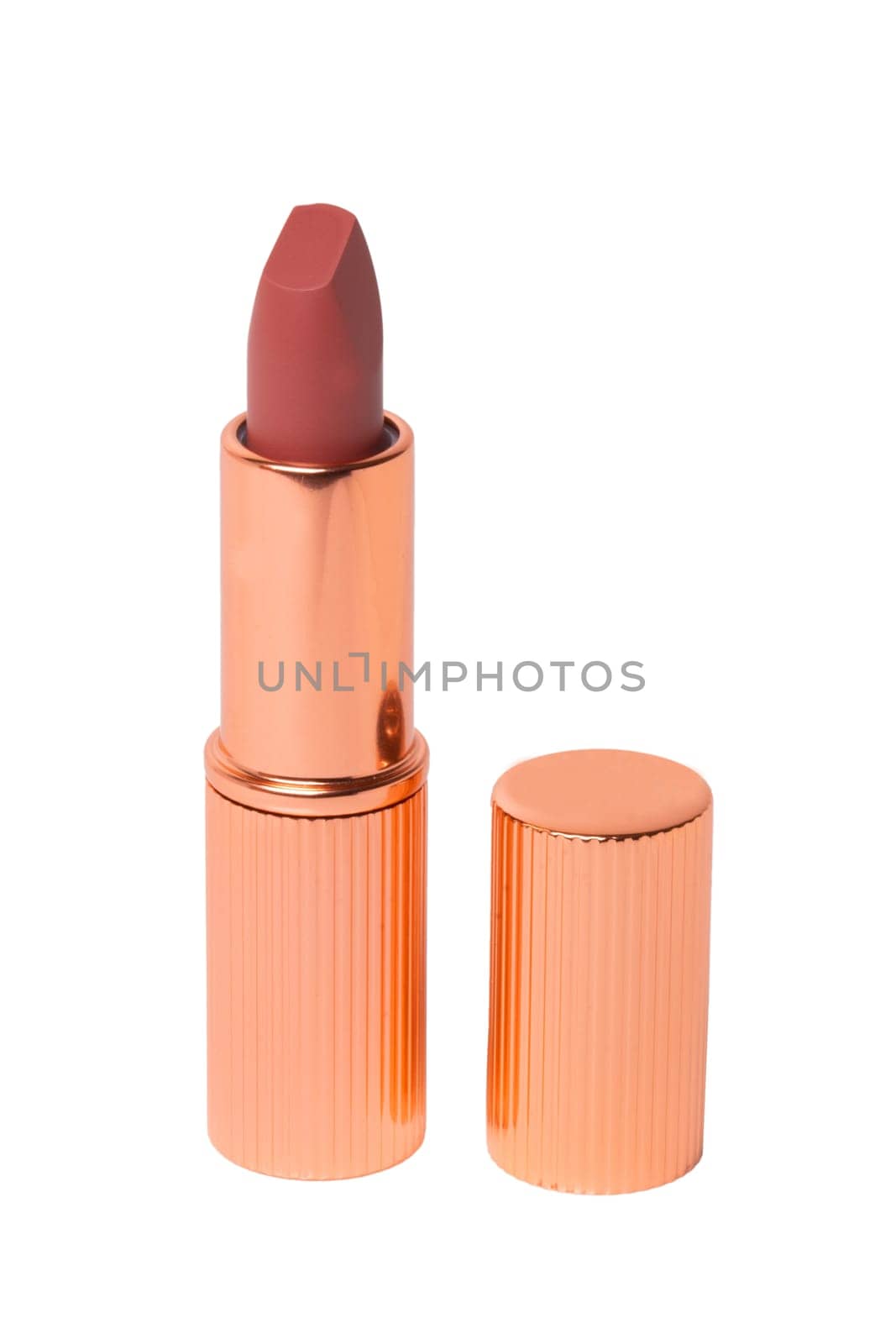 Lipstick isolated. Closeup of a elegant gold red lipstick isolated on a white background. Make-up and beauty concept. Macro.