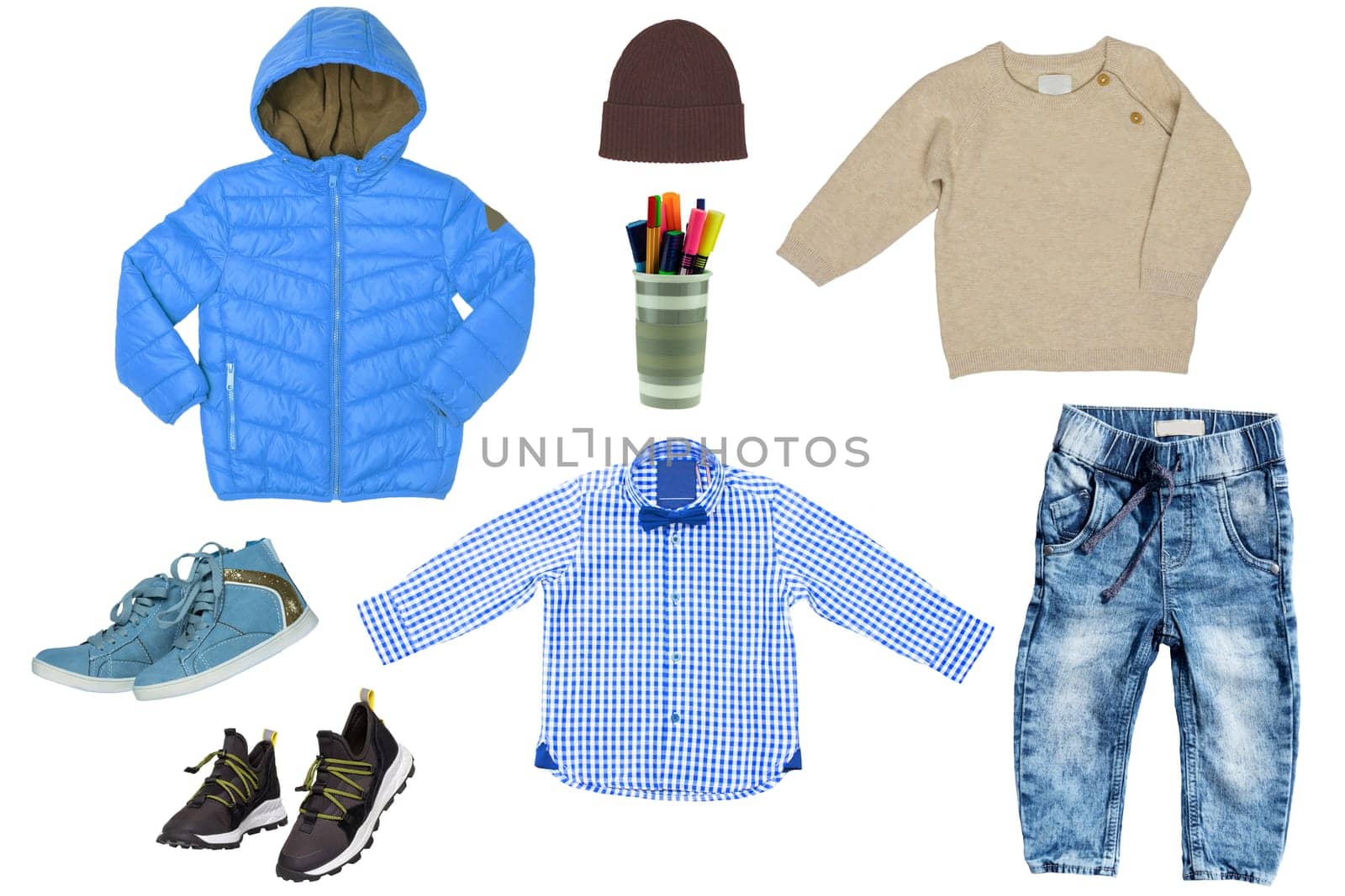 Collage set of little boy autumn clothing isolated on a white background. Denim trouser or pants, shoes, a rain jacket, pullover, shirt and a sweater for child boy. Kids spring and winter fashion.