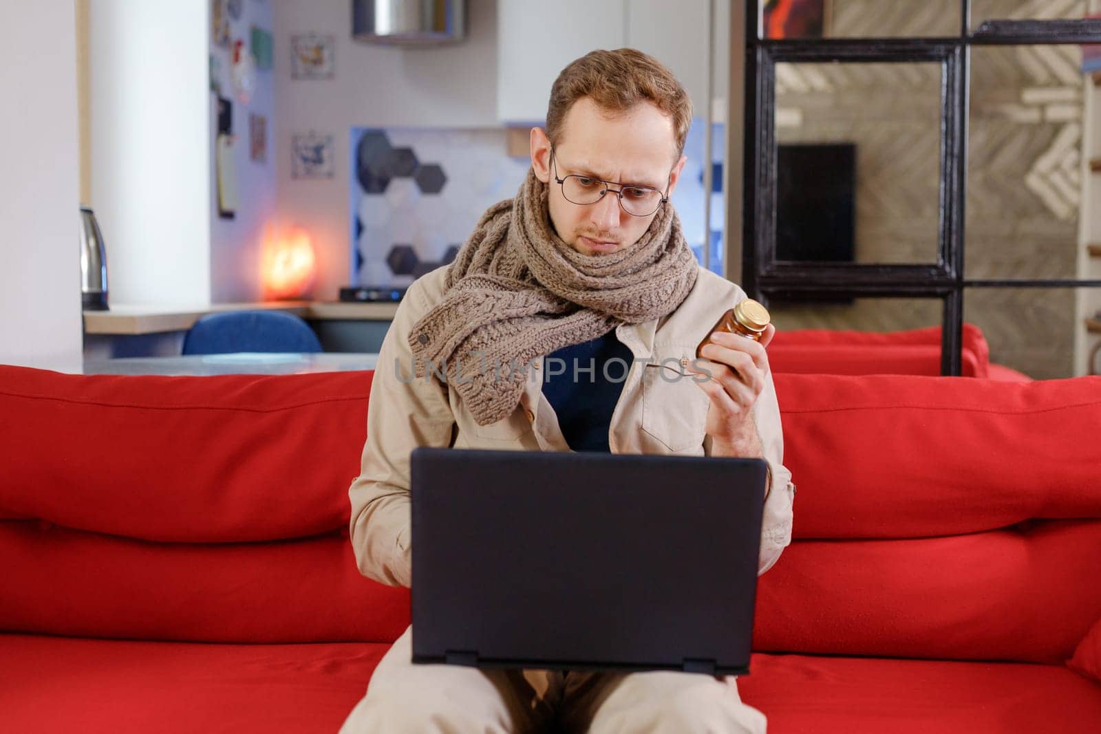 Man looking for prescription and instruction for medicines online with laptop.