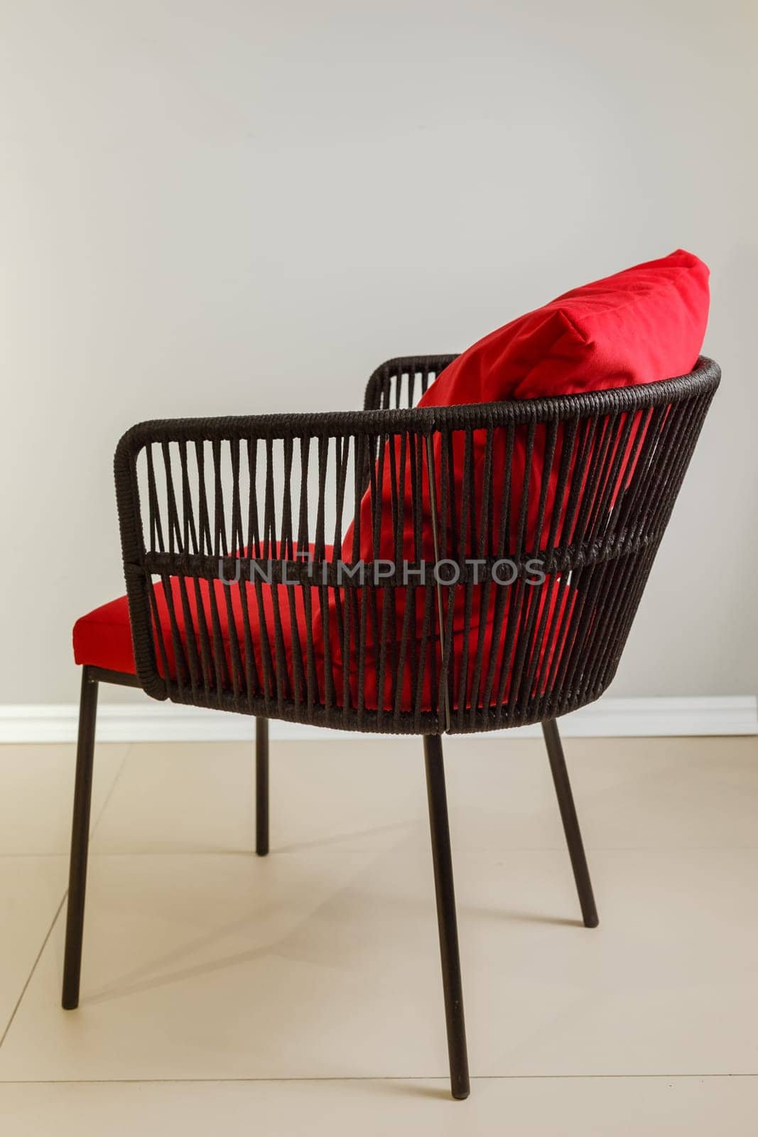 Contemporary wicker kitchen armchair with velour upholstery.