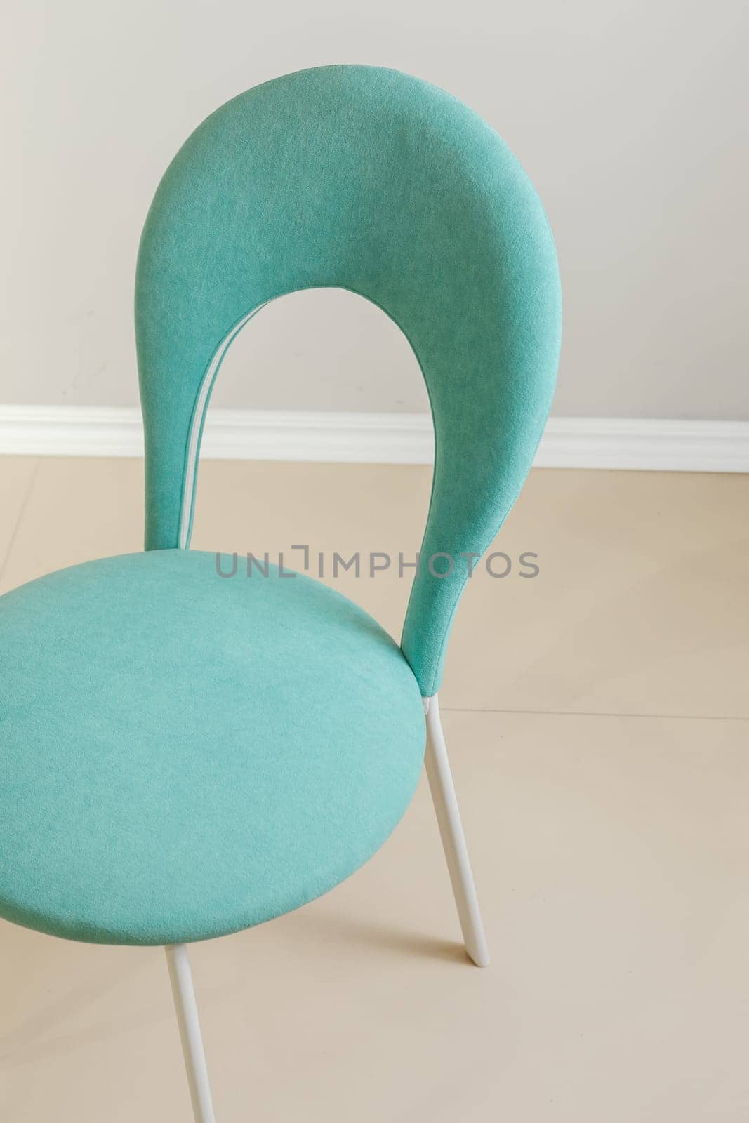 Contemporary modern kitchen armchair with velour upholstery.