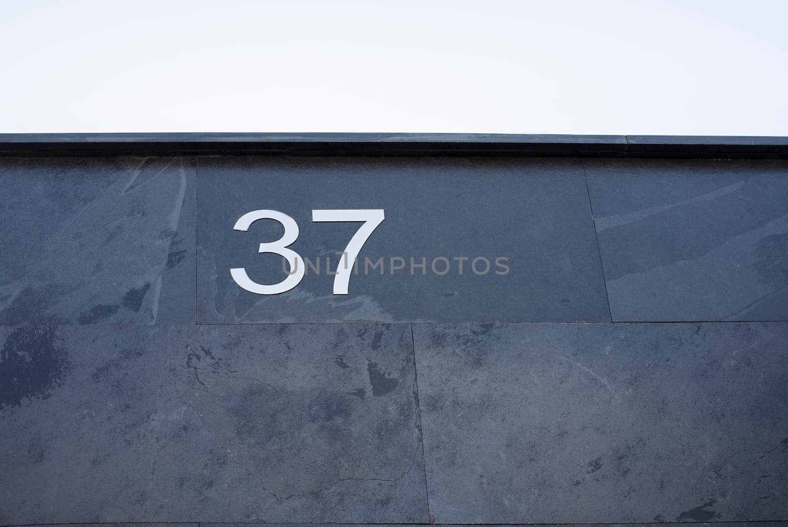 House number 37. Silver over black-blueish slate. Houses with personality concept