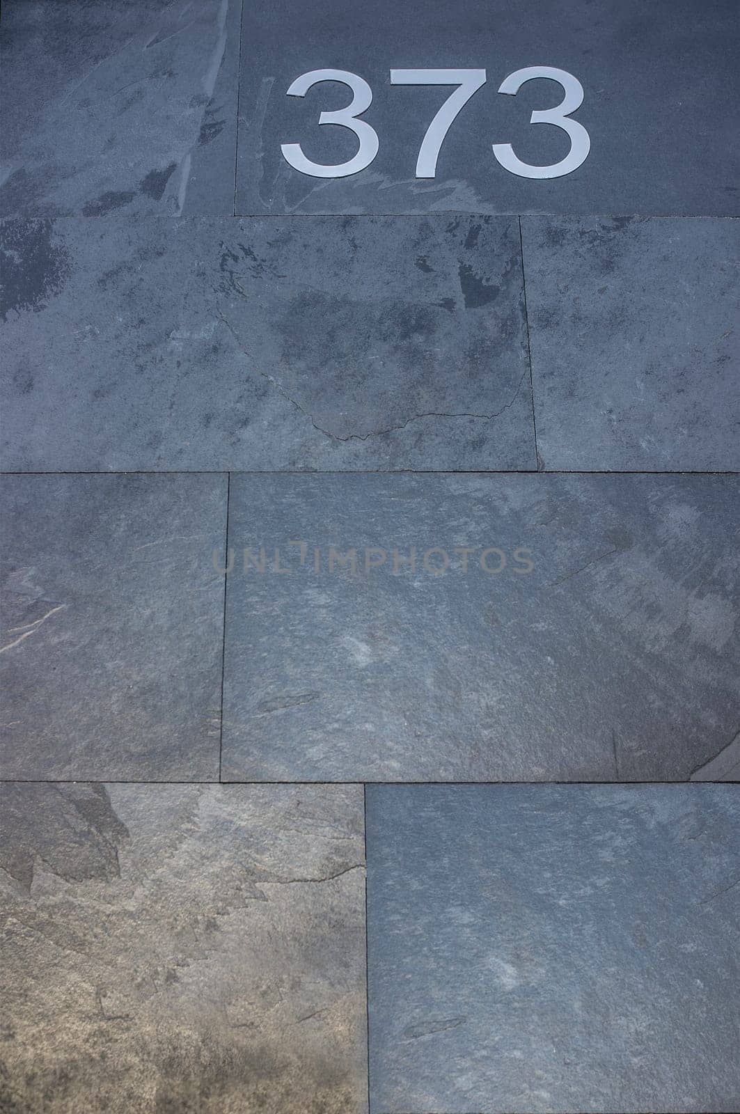 House number 373. Silver over black-blueish slate. Houses with personality concept