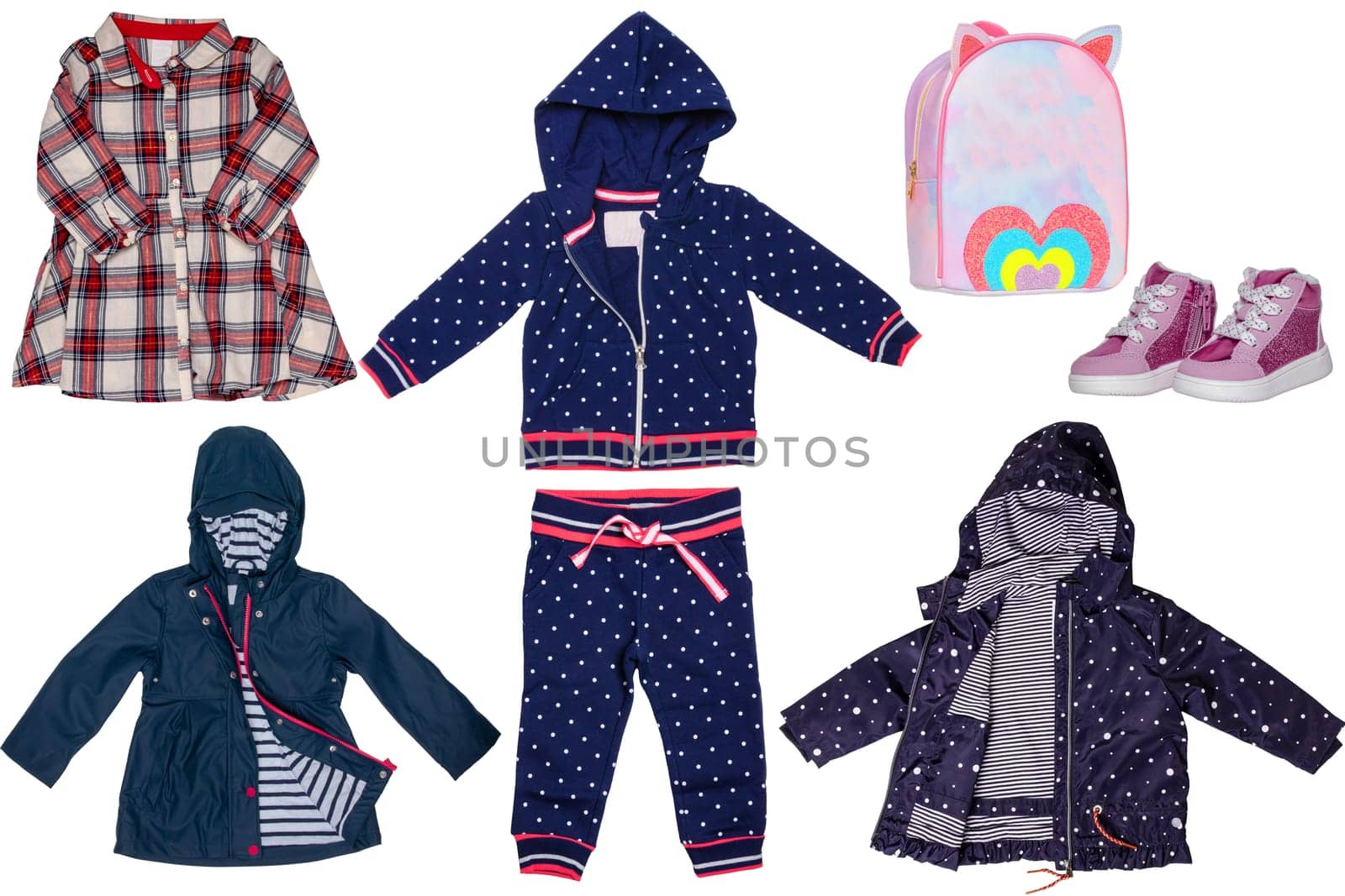 Collage set of little girl autumn clothing isolated on a white background. The collection of two rain jackets, a dress, a hoody and sweat pants, shoes and a bag. Kids winter fashion.