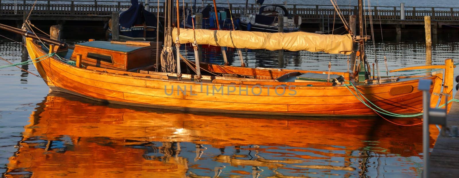Details of a sailboat. A sailboat with a hull made of the finest machined wood.