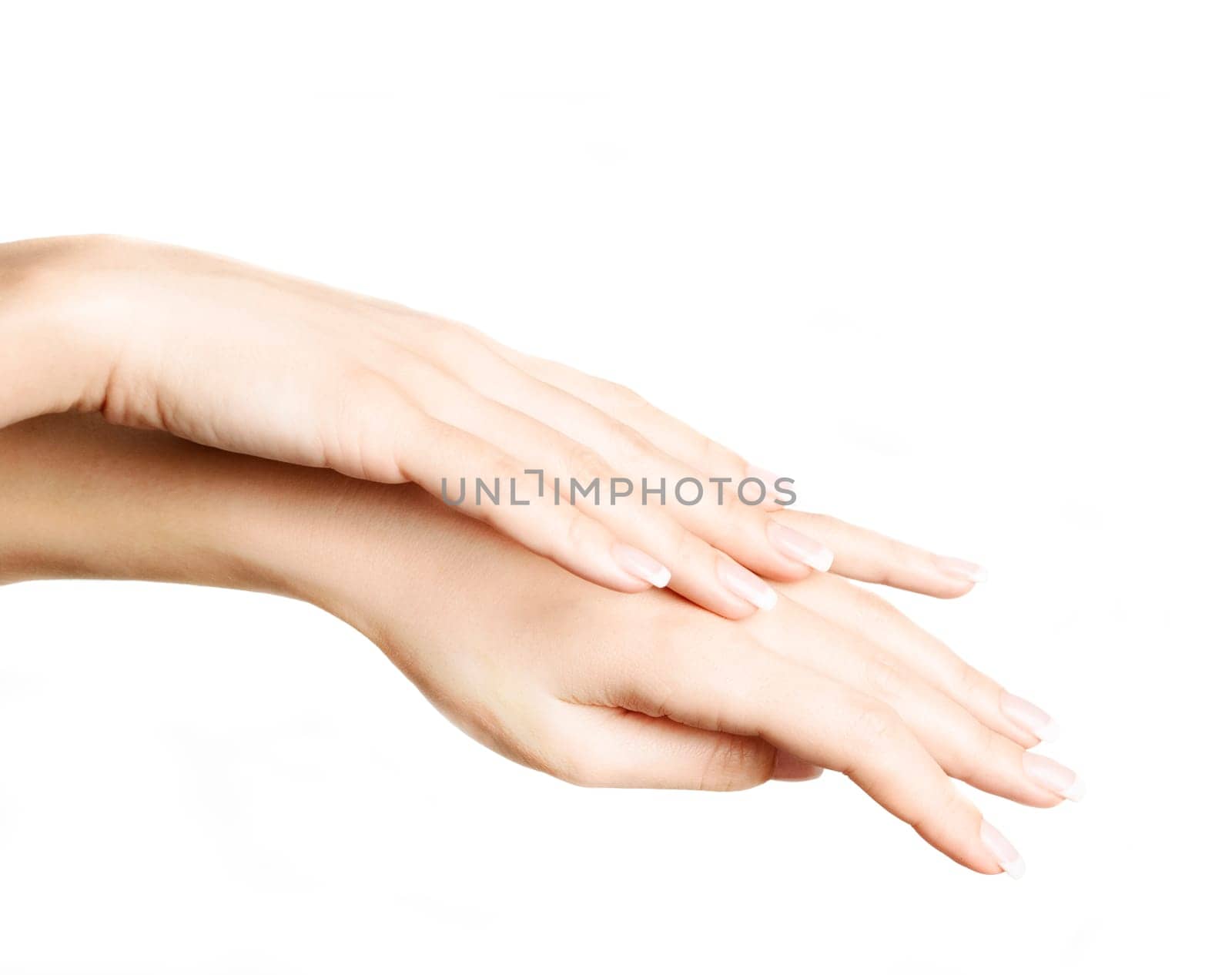 Female hands with french manicure isolated over white