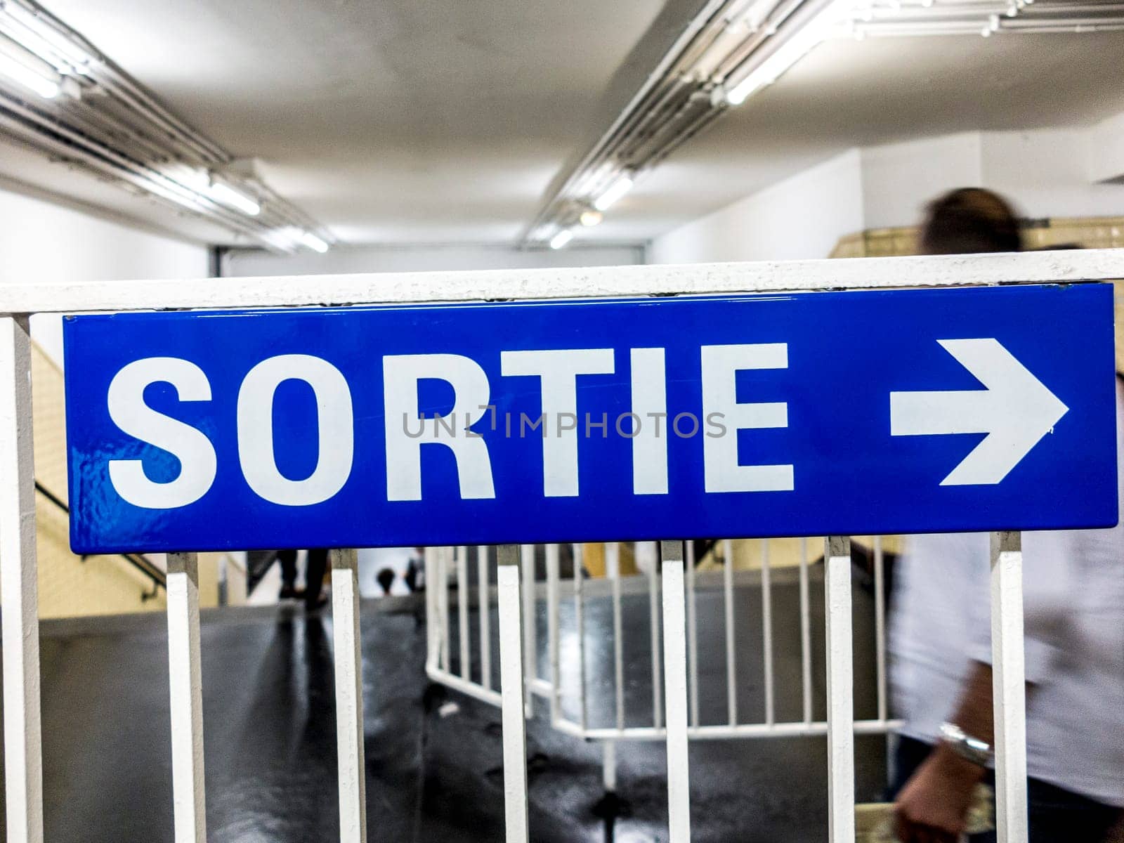 vintage exit sign at Metro in Paris, France