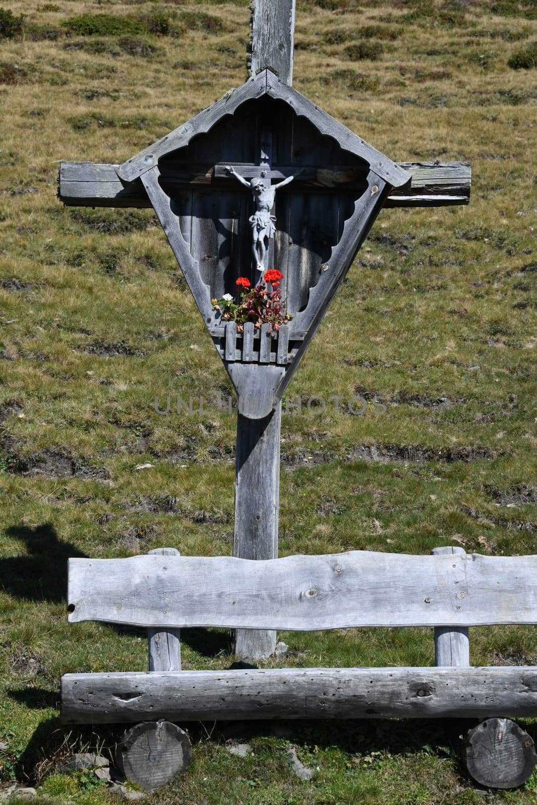 An old,gray wayside cross in the Alpine region of Austria,Germany,Switzerland.