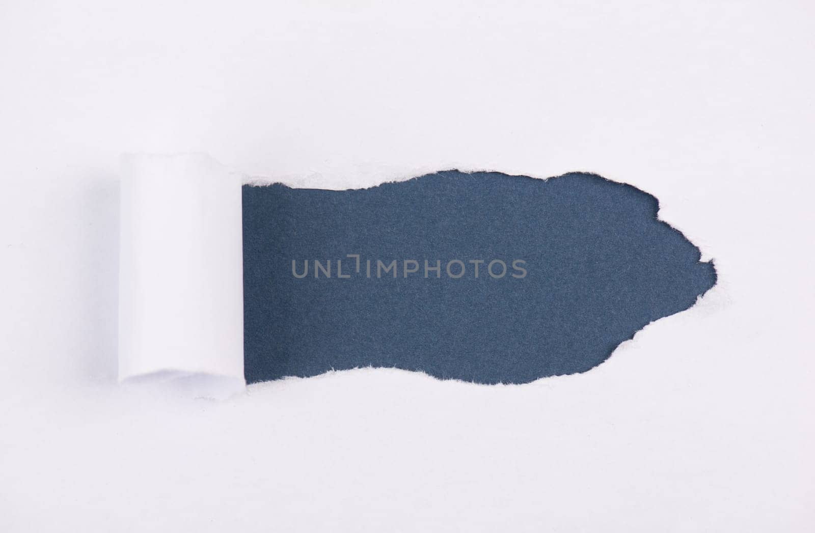 White torn paper, blue background, empty copy space, ripped sheet