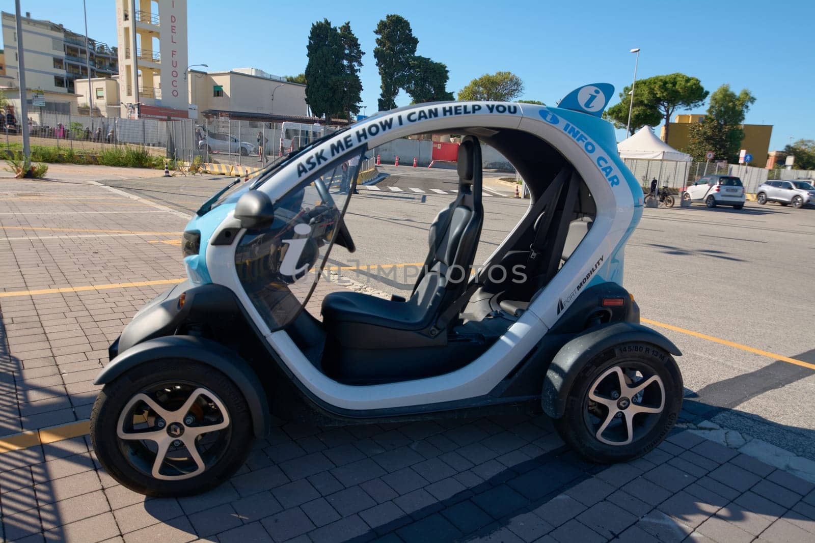 Civitavecchia, Italy - December 19, 2024: An eco-friendly electric vehicle in Civitavecchia, serving as an information car for tourists. The compact design enhances urban mobility and convenience.