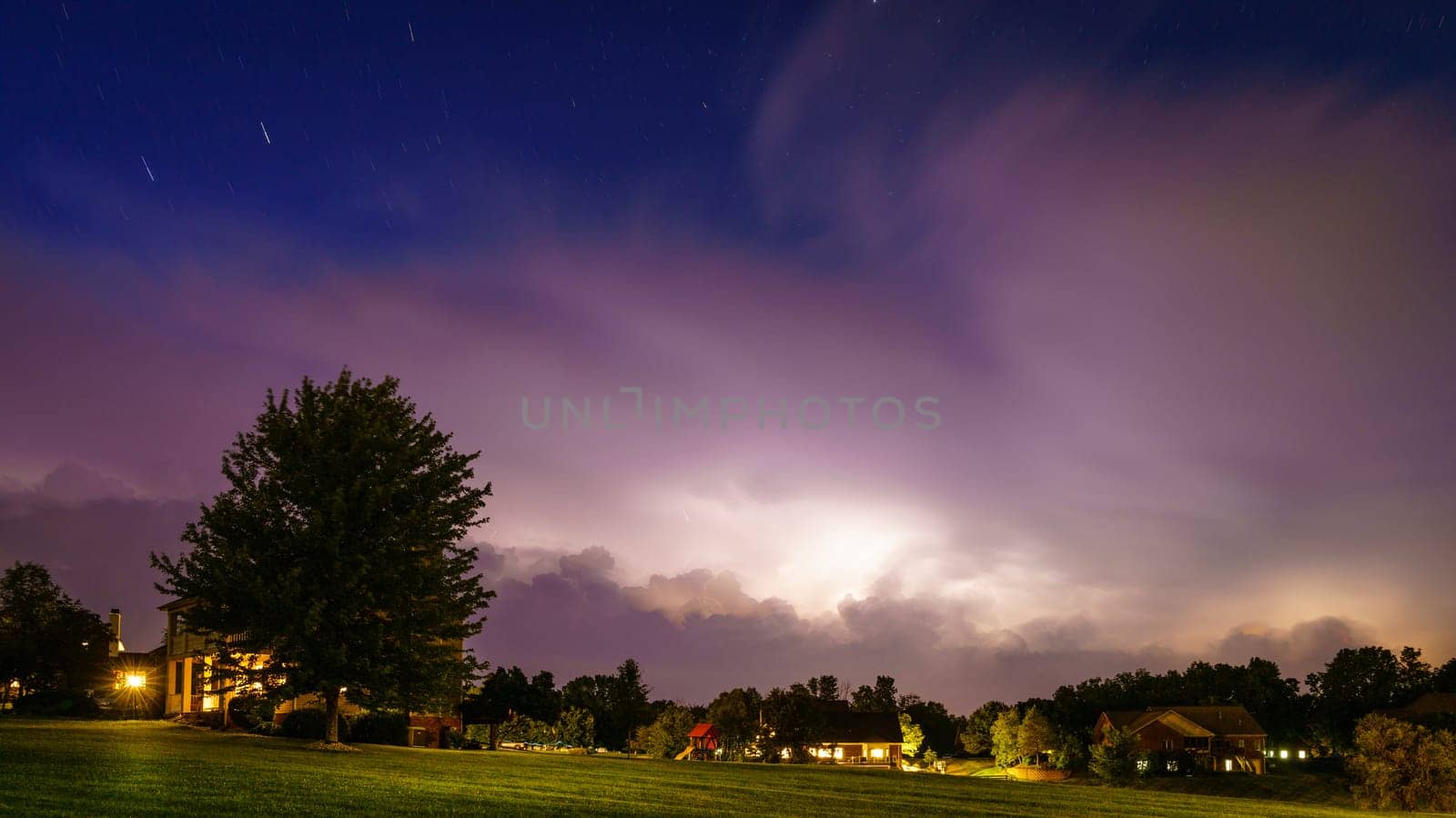 Nighttime view of a residential neighborhood in Central Kentucky with approaching thunderstorm