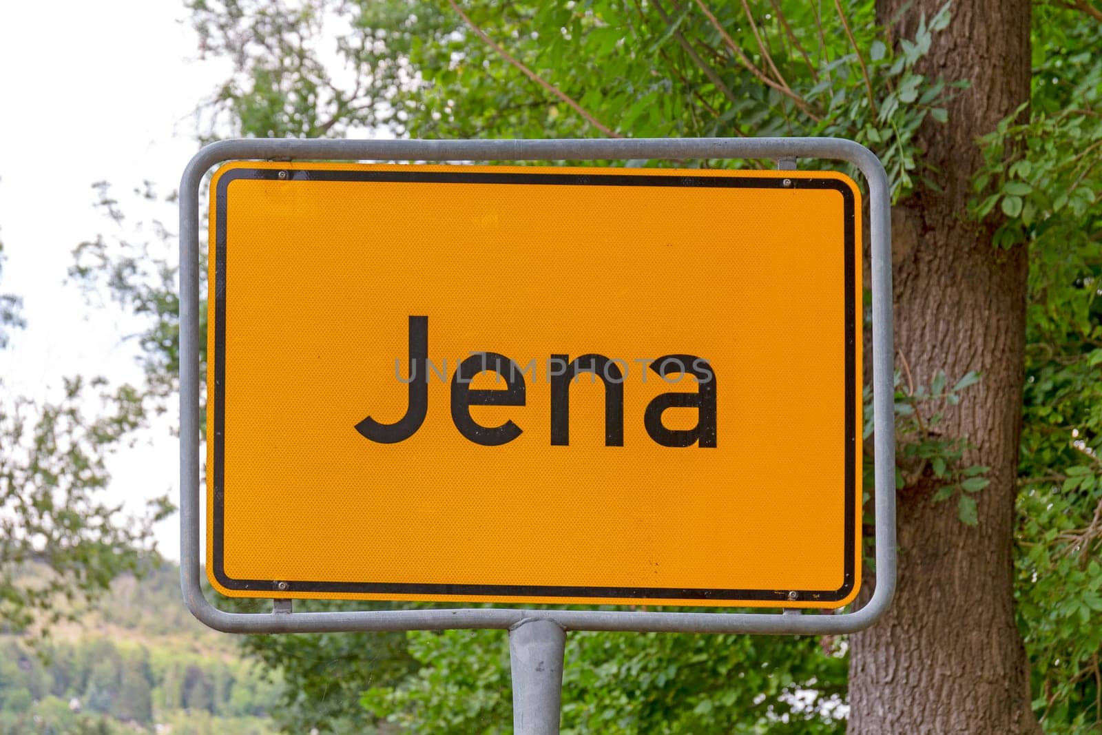 Jena city limit road sign in yellow