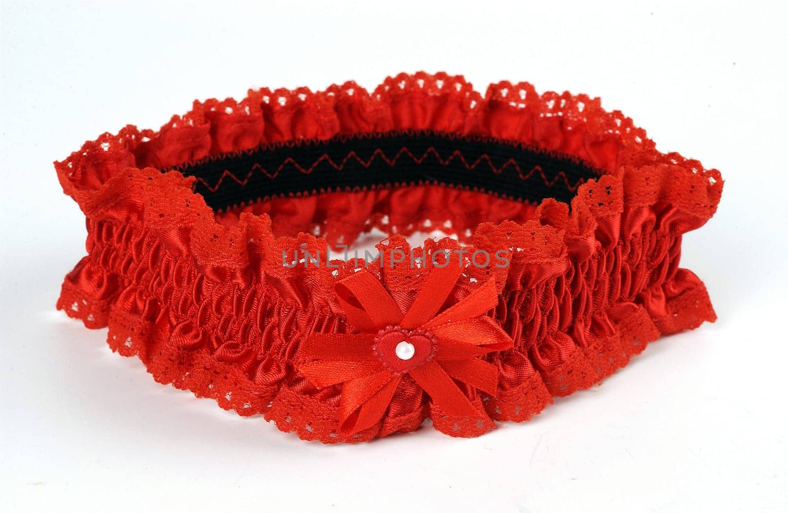 lacy red, garter on a white background