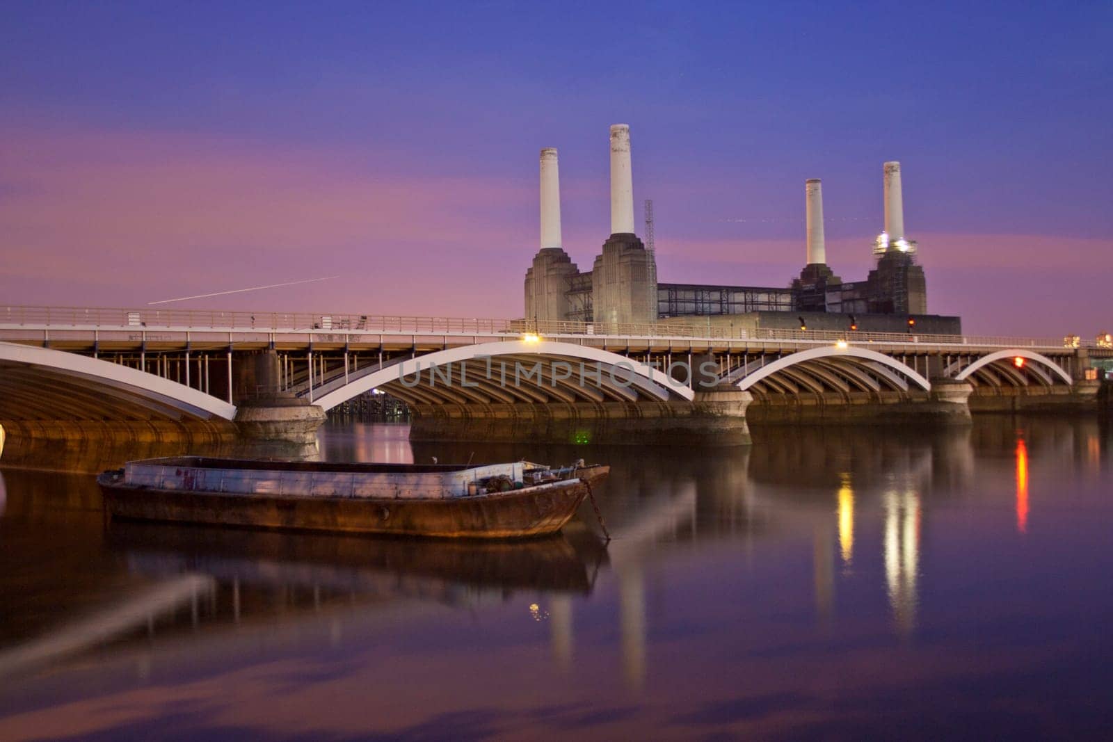 A night scene of the Thames river Battersea Power Station and rail brige