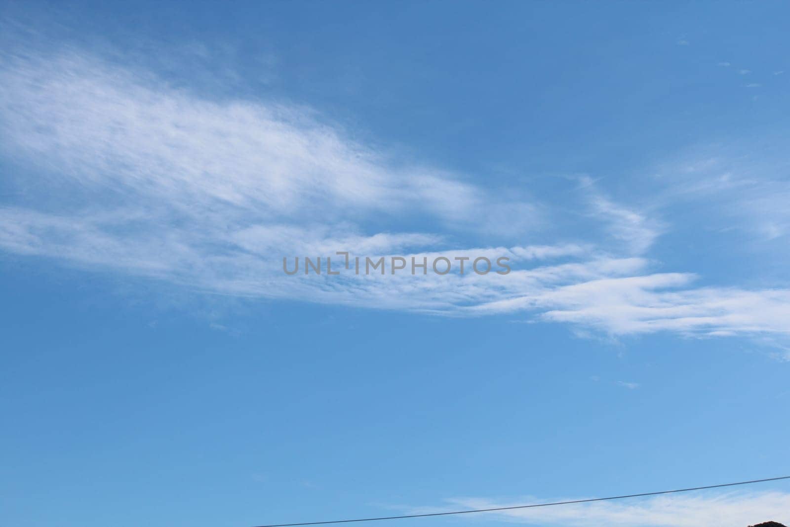 Blue sky background with clouds. white fluffy clouds on blue sky in summer
