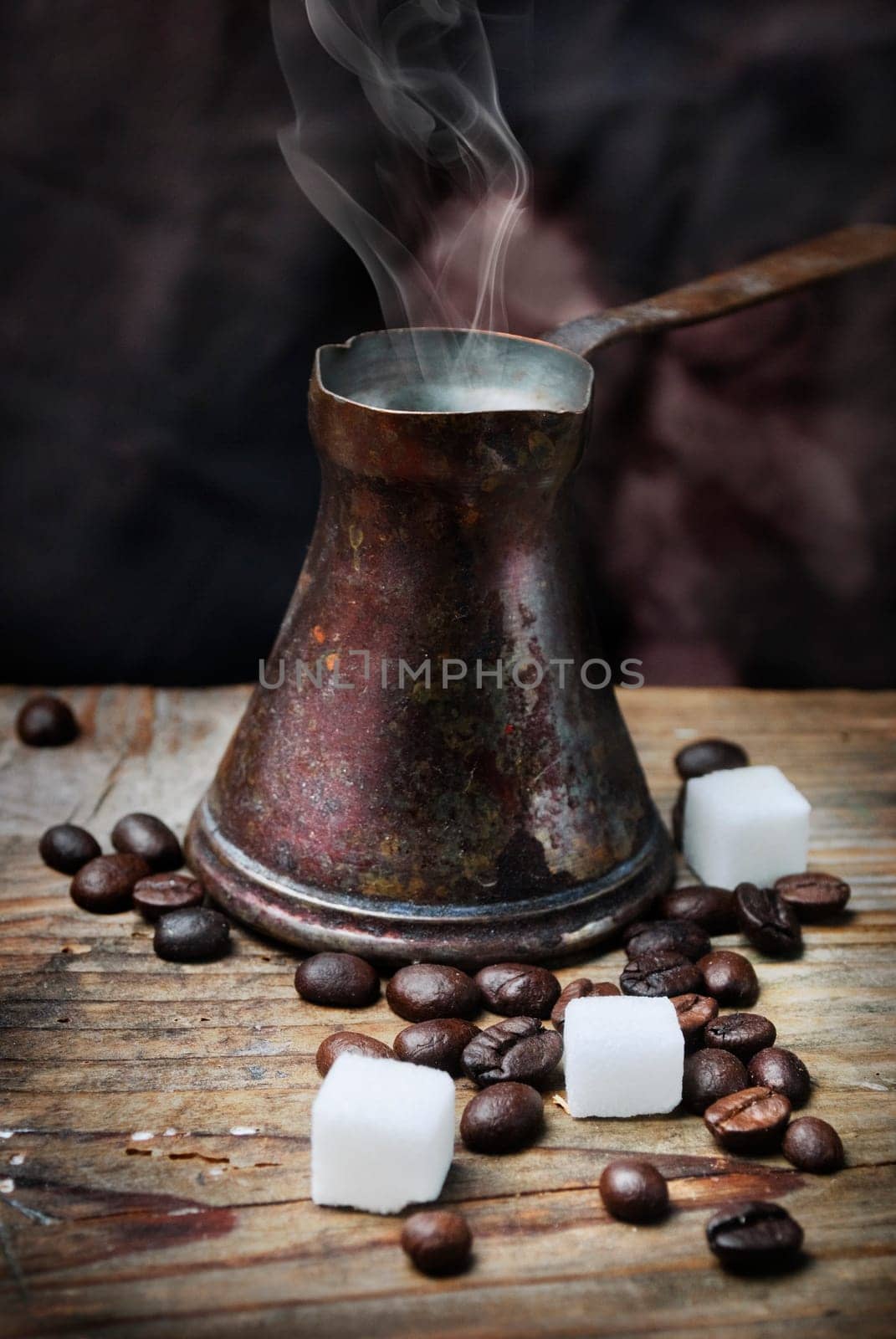 Vintage oriental coffee pot on grunge wooden plank